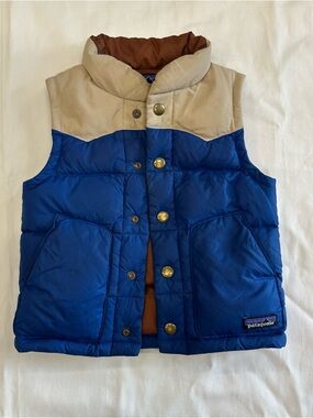 Adorable Patagonia cream and royal blue puffer vest with snap buttons.